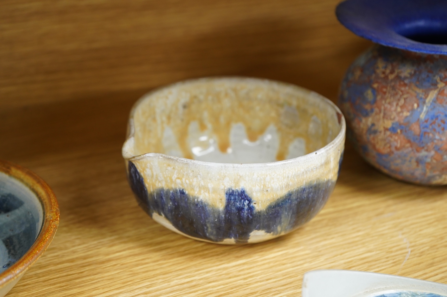 A collection of studio pottery to include crystalline glazed works by Stephen R Jones Des, Brighton, vases and a pair of dishes, largest 22cm high